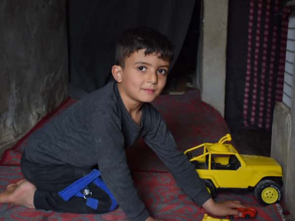 Shadi is a child orphaned by the earthquake.