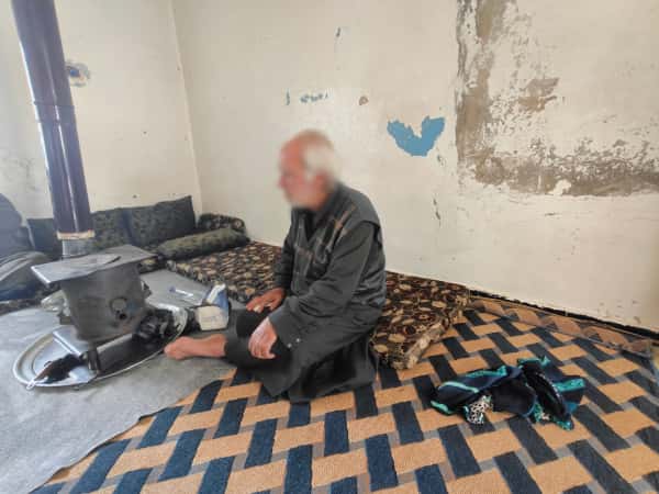 An old couple burdened with pain