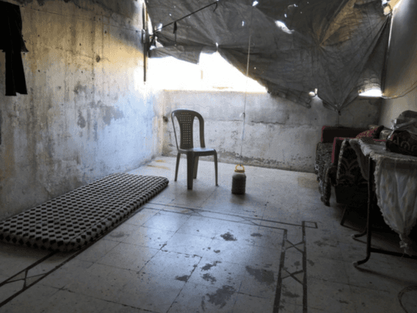 A family lives in a roofless house
