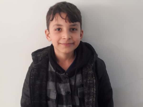 Taim is a child who has been orphaned as a result of the earthquake