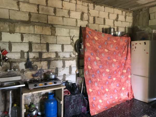 A family lives in an unfinished house in worst living conditions.