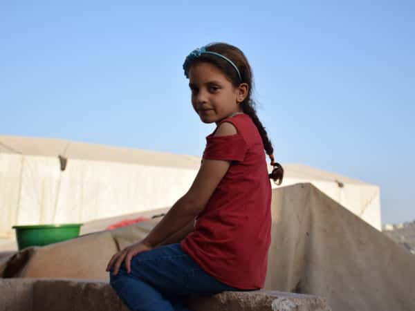 Afra is an orphan girl from the northern Hama countryside