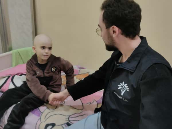 A child’s smile… hiding a harsh battle.