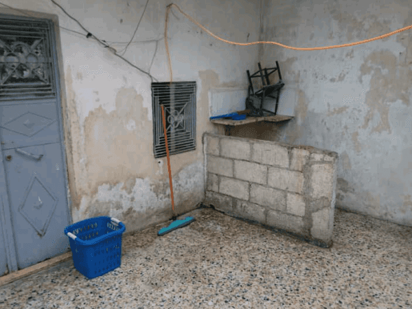 A refugee family lives in a house without furniture