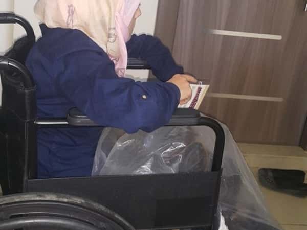Injured woman needing a wheelchair