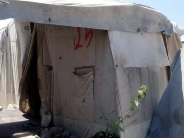 A family living in a poor tent