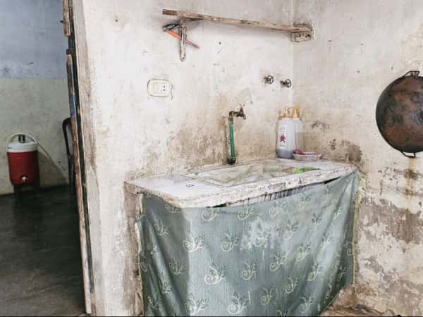 Earthquake-Damaged House, Bombed Home, Heavy Debts