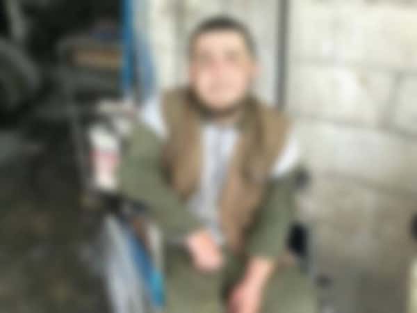 A young man suffering from paralysis