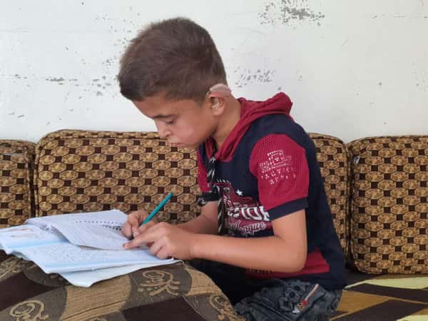 Omar is an orphan from Aleppo