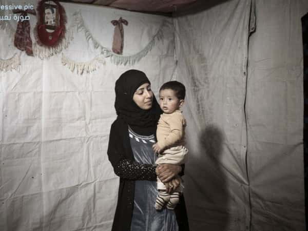 A mother and her child needing treatment expenses