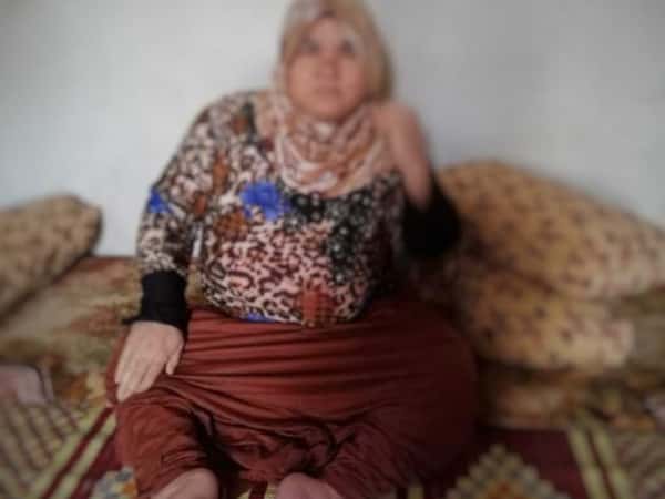 A woman born paralyzed, needs a wheelchair.
