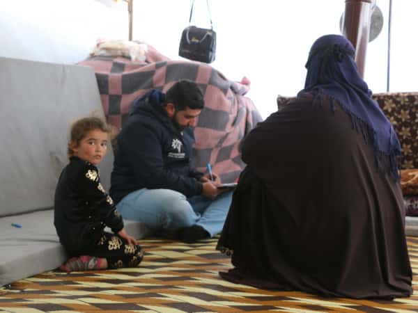 Leila stands helpless unable to support her children.