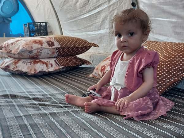 Qamar is dealing with a heart defect, growth failure, and poor absorption, all of which are significant health challenges.