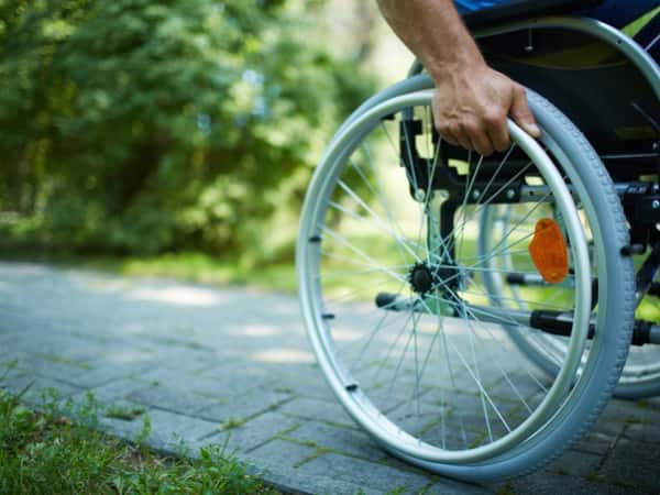 Wounded patient in need of a wheelchair