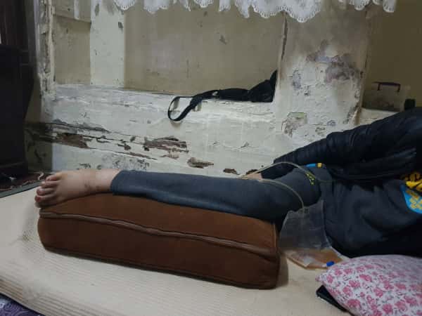 A young man suffers from back injury