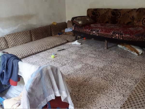 A family lives in a house that lacks the basic needs of living.