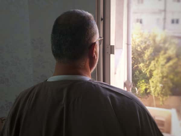 An elderly man needs MRI and medications