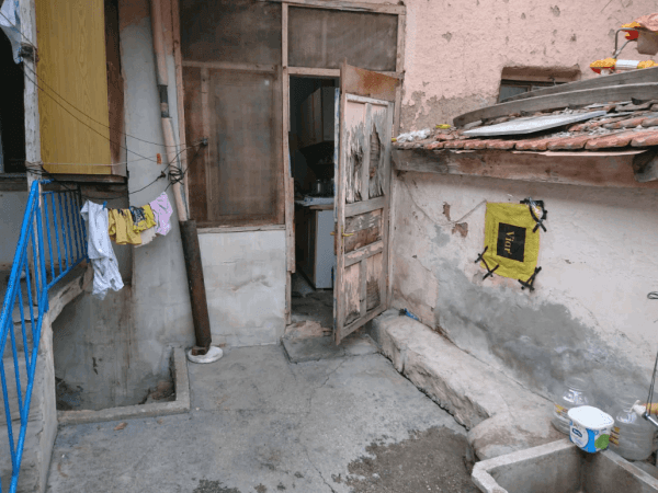 A family living in a miserable house