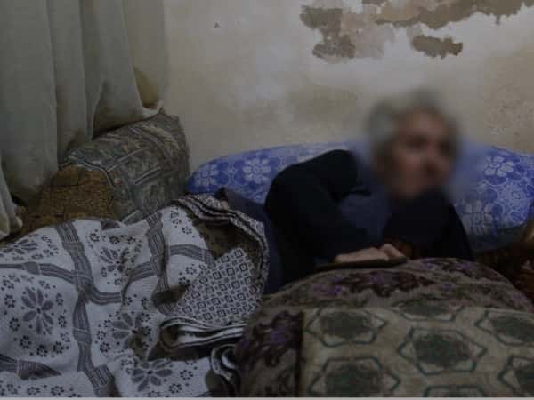 An elderly man needs a wheelchair and medications