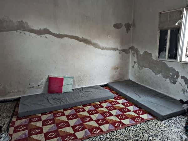 A widow lives in an unfinished house with her children