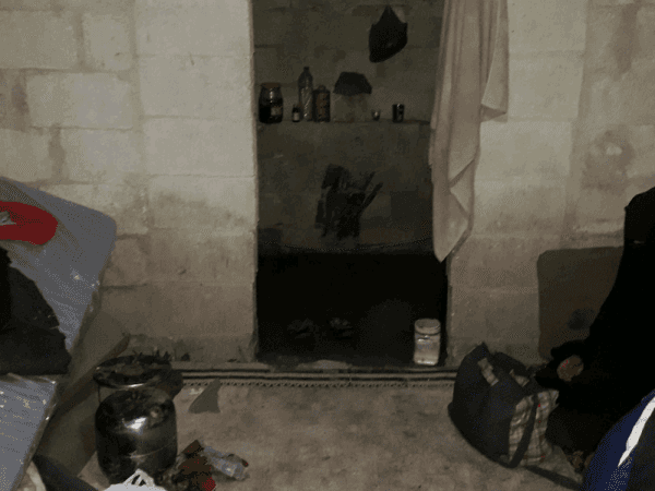 Woman soon to give birth inside a tent
