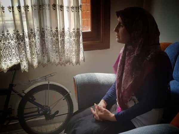 A woman suffers from hearing impairment