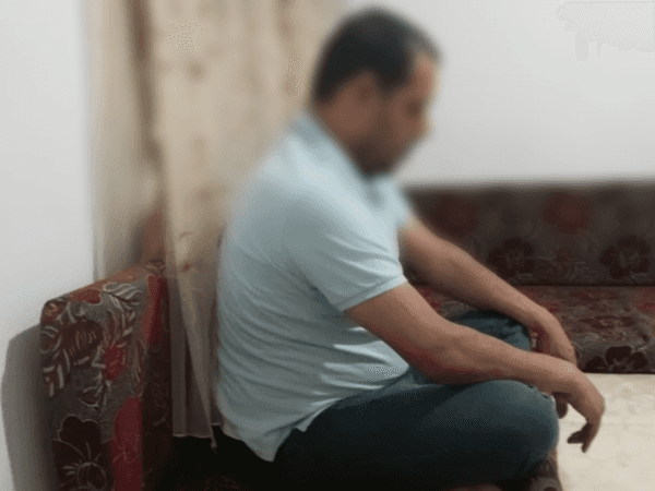 A man with back and feet pains