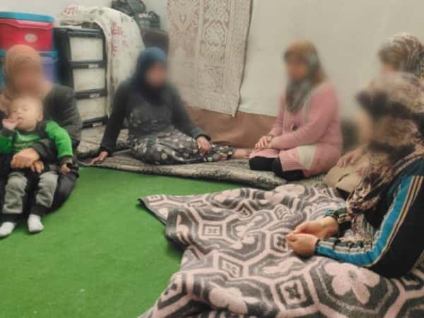 A mother of martyrs and the support of her grandchildren.