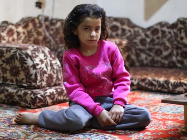 Yasmin is an orphan girl from the city of Homs
