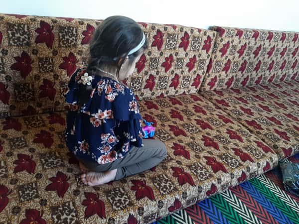 Asia, an orphan, who lost her father in a bombardment