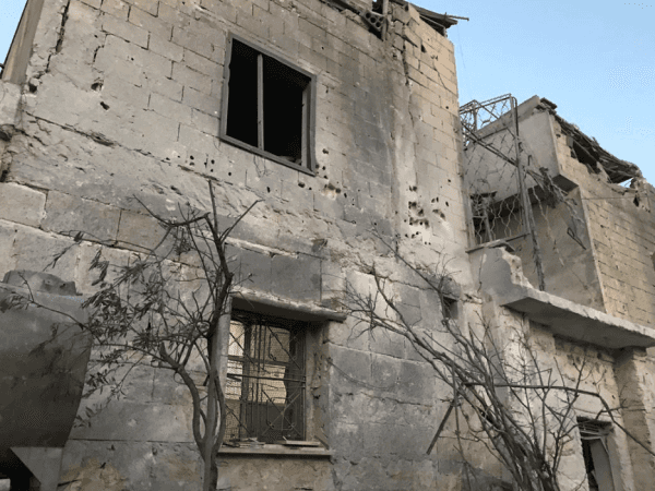 A family needs to repair their house after the bombardment