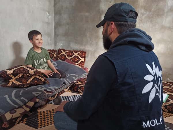 Stand with Hamida and Her Son