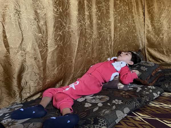 A child who is paralyzed, cannot speak or see, needs medication!