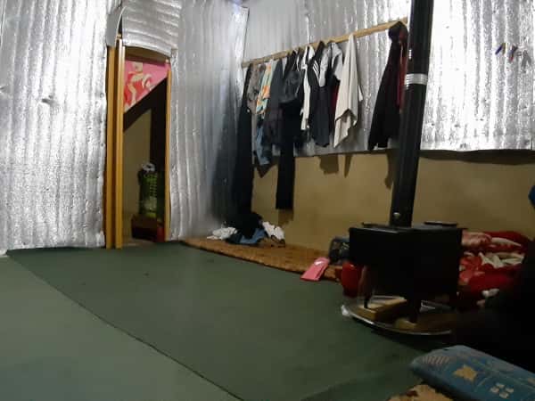A mother lives alone with her son in a camp